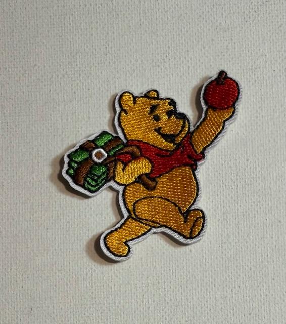 Pooh - holding apple patch