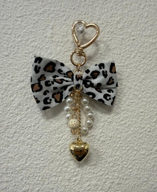 White leopard bow charm