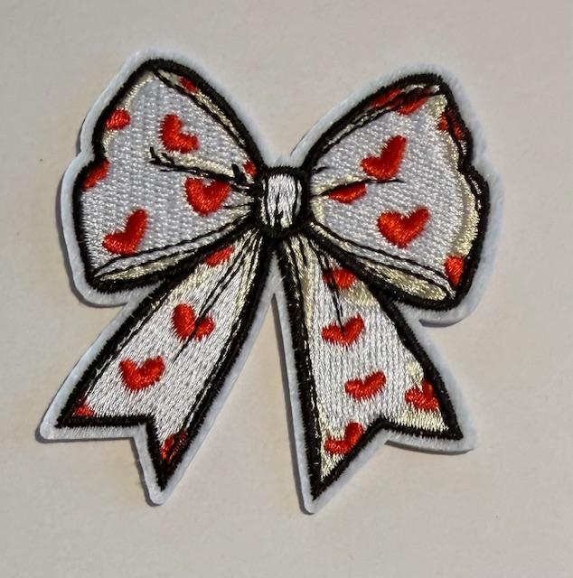 White Valentines bow w/ red hearts black outline hat patch