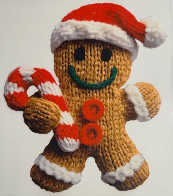 Gingerbread man holding candycane