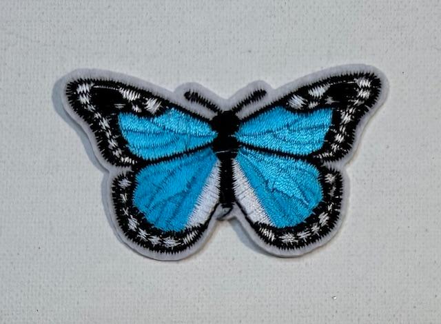teal/black butterfly hat patch