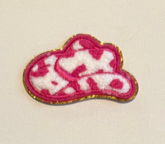Hot pink cowboy hat, gold outline hat patch