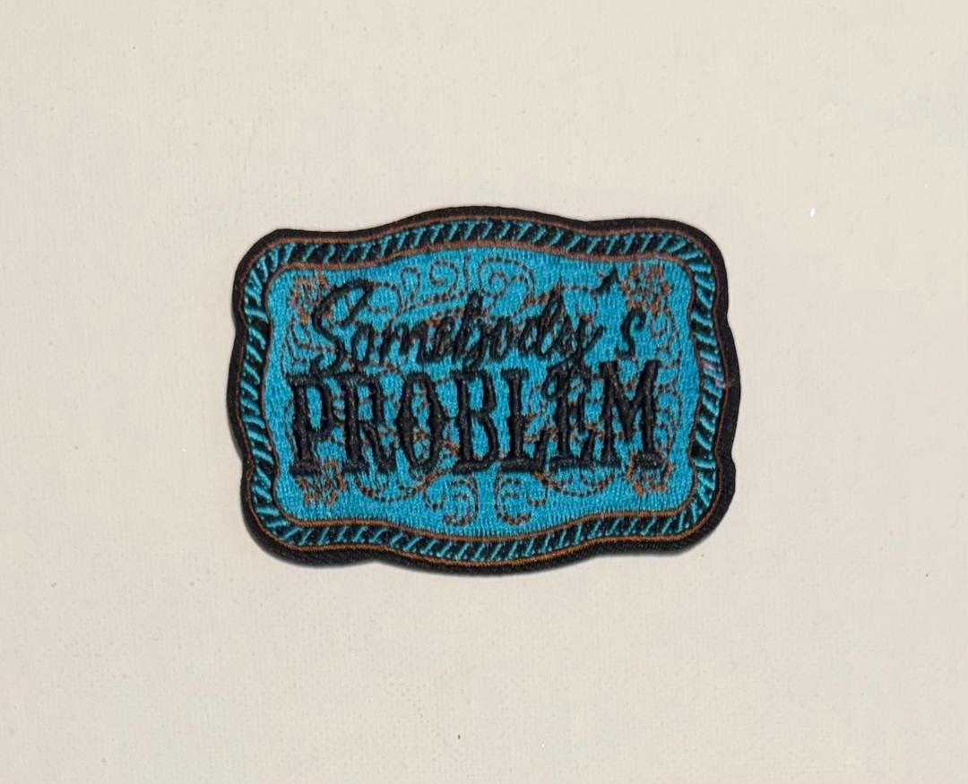 Teal Buckle, Somebody's Problem hat patch