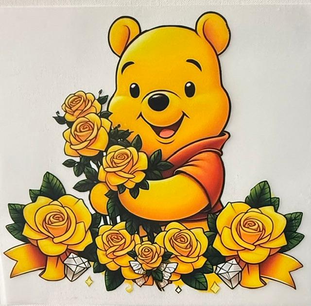 Pooh - holding yellow roses