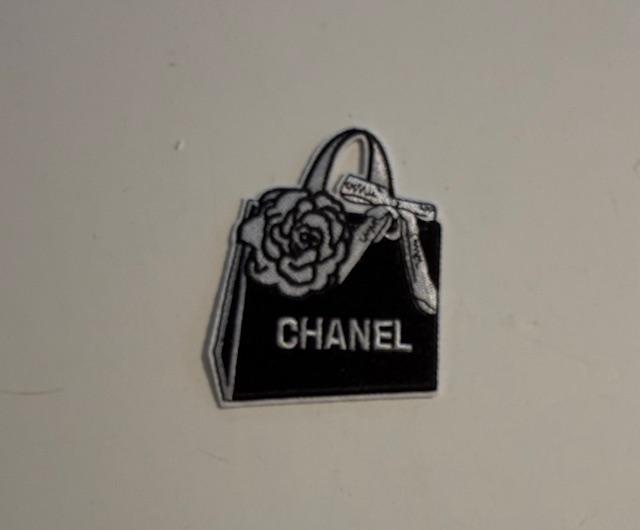 Chanel-black purse hat patch