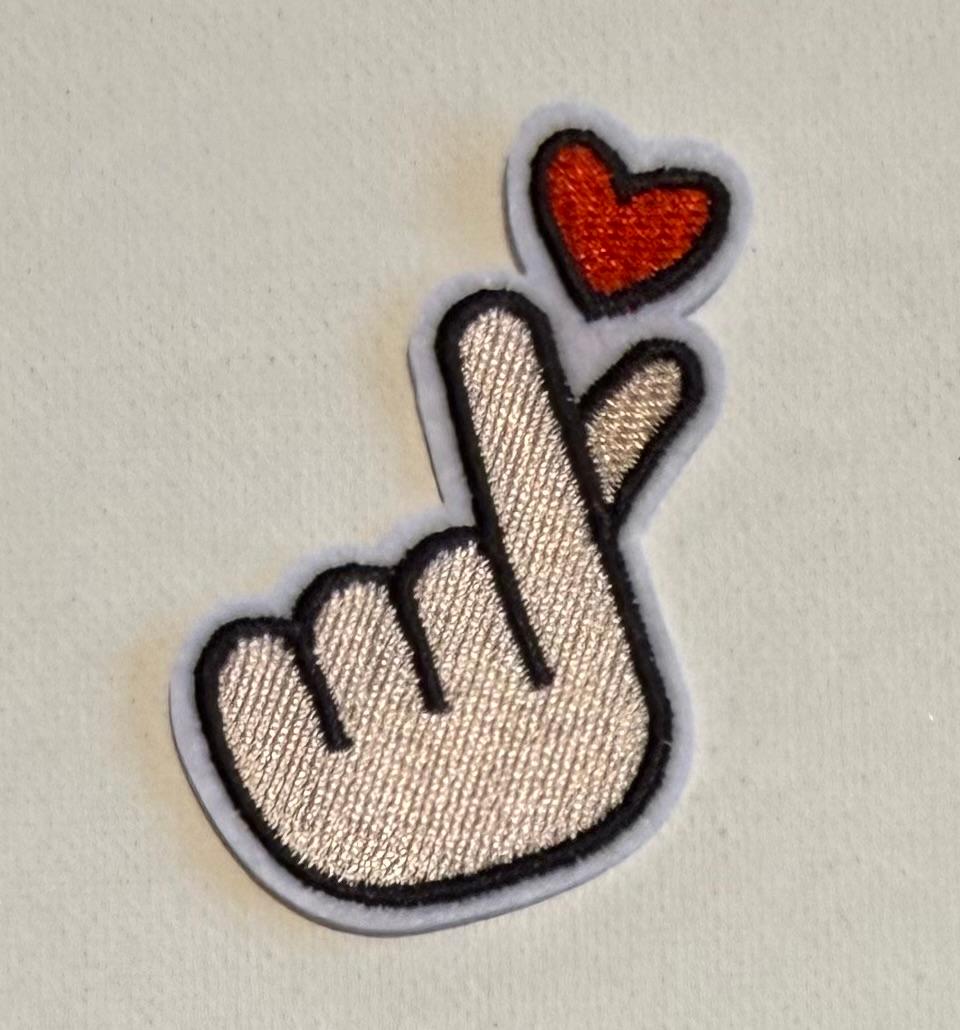 Finger heart hat patch